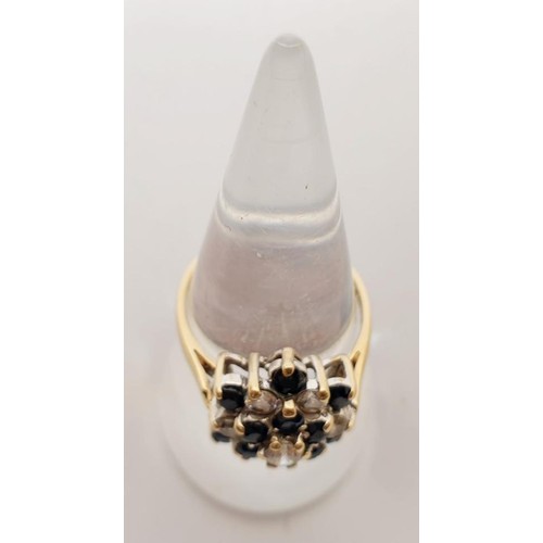 50 - A 9ct gold cluster ring set with cubic zirconia, gross weight 3.6g, size P. UK shipping £14.