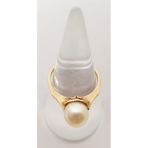 64 - A yellow metal (mark rubbed) and pearl ring, gross weight 2.5g, size L/M. UK shipping £14.