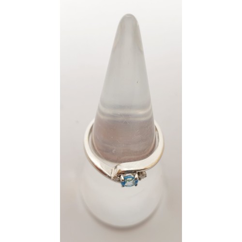 55 - A hallmarked 9ct white gold ring set with diamond and blue stone, gross weight 2g, size N/O. UK ship... 