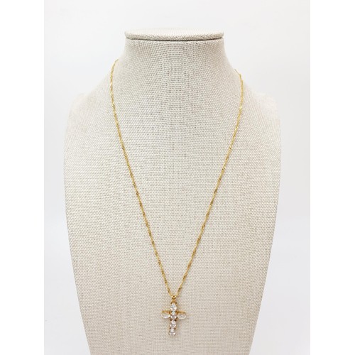 69 - A 9ct gold cross set with six clear stones on a 9ct gold chain, chain length 44cm, gross weight 3.6g... 