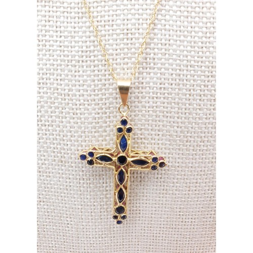 71 - A 9ct gold lattice work cross set with red stones on a 9ct gold chain, chain length 44cm, gross weig... 