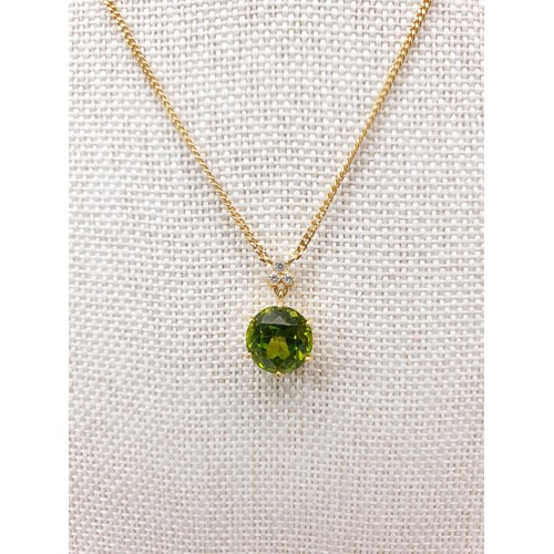 72 - A hallmarked 18ct gold peridot and diamond pendant on a hallmarked 18ct gold chain, chain length 40c... 