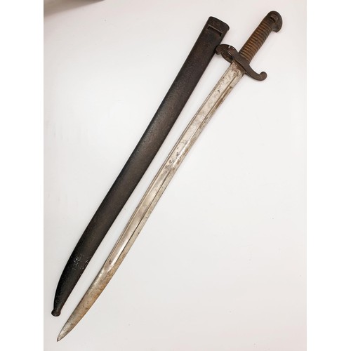 284 - A French Chassepot 1842 pattern bayonet, dated 1865 with scabbard, length 70cm. No Shipping. Arrange... 