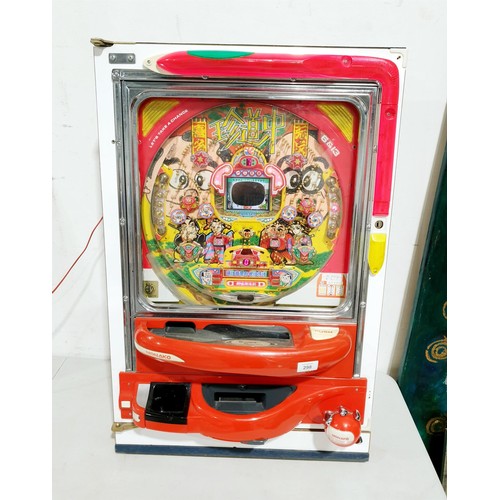 A vintage Japanese Pachinko machine, length 80cm, with transformer. No ...