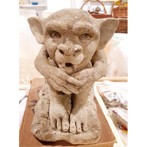 A reconstituted stone grotesque garden ornament, height 20cm. No ...