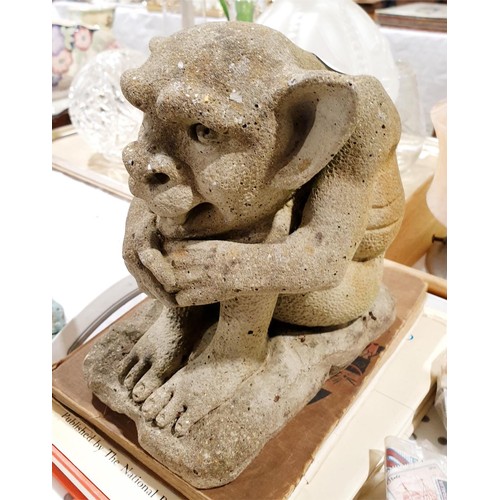 A reconstituted stone grotesque garden ornament, height 20cm. No ...