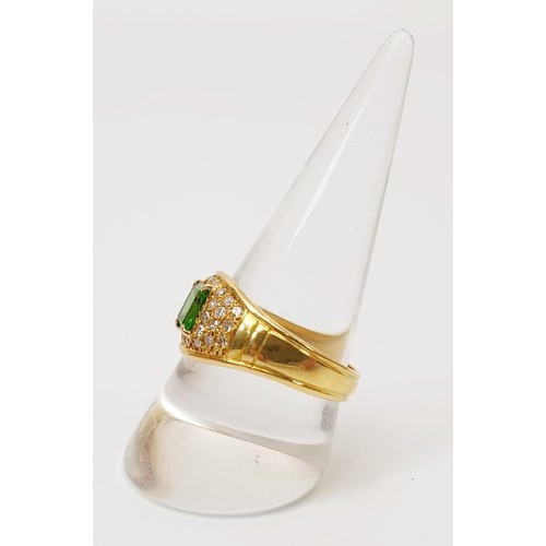 22 - A hallmarked 18ct gold diamond and emerald ring, gross weight 7.7g, size T/U. UK shipping £14.