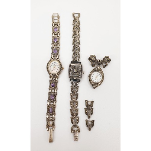 35 - Two 925 silver quartz cocktail watches set with marcasite and purple stones, A/F, together with a 92... 