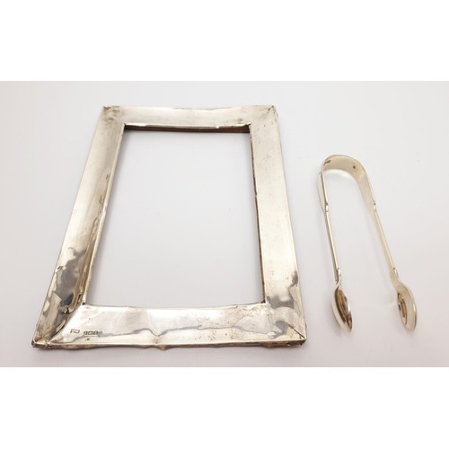 47 - A pair of hallmarked silver sugar tongs, weight 41g, London 1902 together with a scrap hallmarked si... 