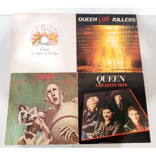 100 - A selection of vinyl LPs including Queen, Cliff Richard and Elvis. UK shipping £14.