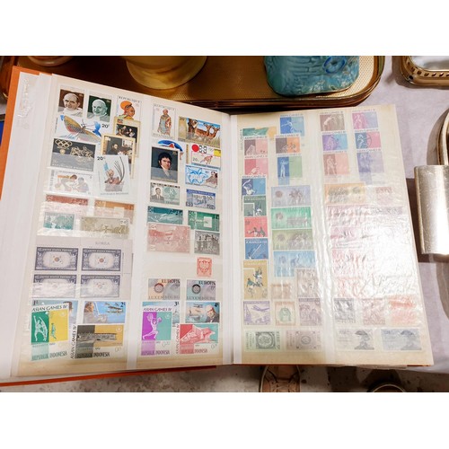 106 - A selection of mint world stamps and loose stamps. UK shipping £14.
