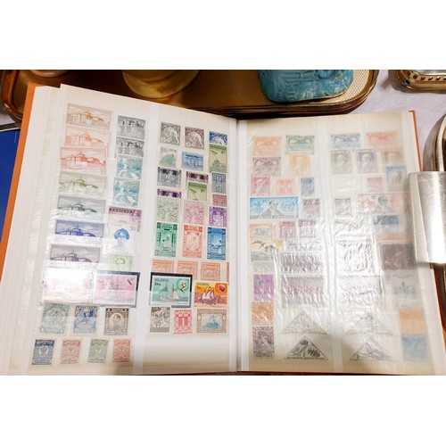 106 - A selection of mint world stamps and loose stamps. UK shipping £14.