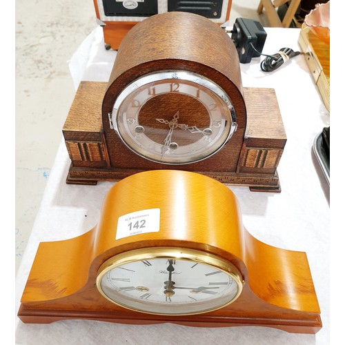 142 - A vintage oak cased mantel clock together with a modern Blandford mantel clock. No shipping. Arrange... 