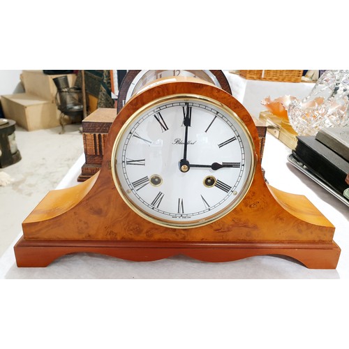 142 - A vintage oak cased mantel clock together with a modern Blandford mantel clock. No shipping. Arrange... 