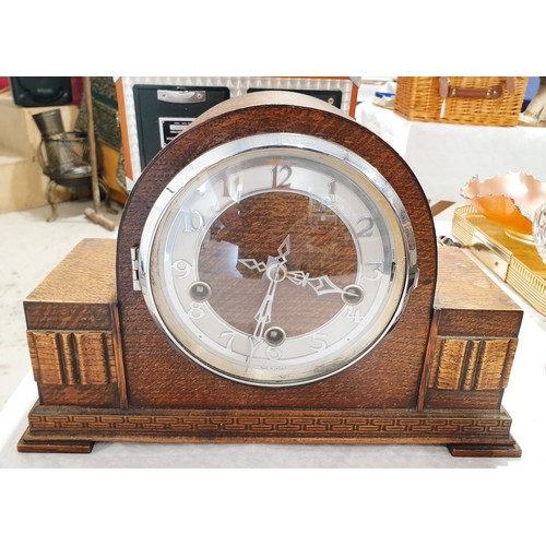142 - A vintage oak cased mantel clock together with a modern Blandford mantel clock. No shipping. Arrange... 