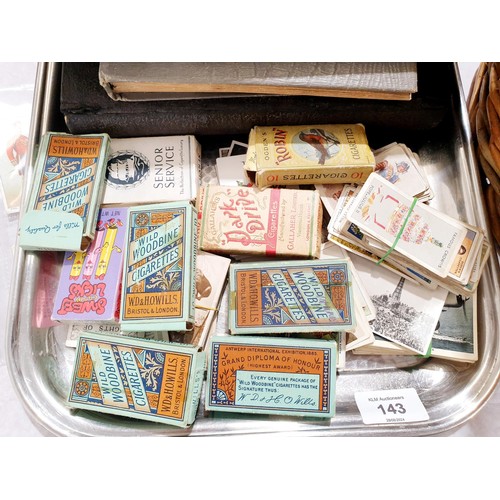 143 - Cigarette card albums and loose cigarette cards.
UK shipping £14.