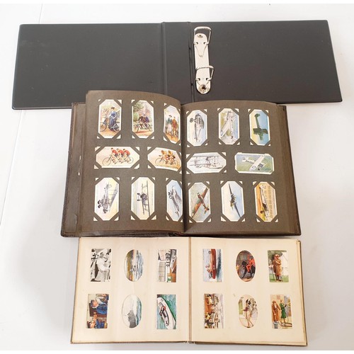 143 - Cigarette card albums and loose cigarette cards.
UK shipping £14.