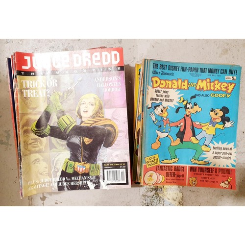 189 - A selection of comics including Judge Dredd and Walt Disney. UK shipping £14.