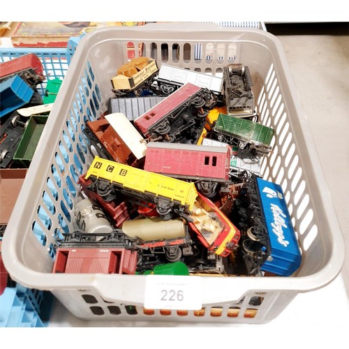 226 - Three boxes of 00 gauge rolling stock and locomotive parts. UK shipping £14.