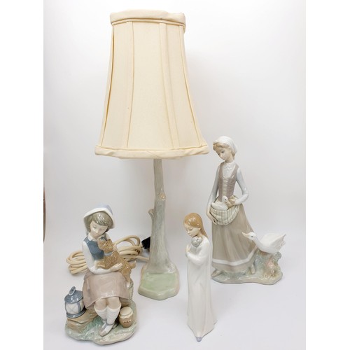 120 - A Lladro figure of a girl with geese, height 31.5cm, a Lladro figure of a girl with a dog and a Nao ... 