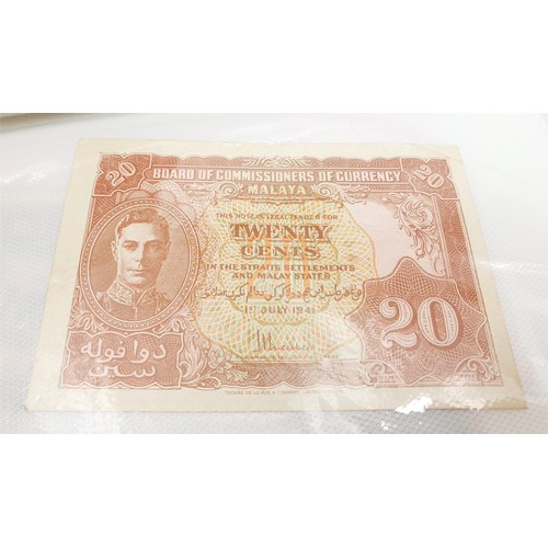 21 - Selection of bank notes including WWII Malaya cent notes. UK shipping £14.