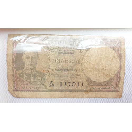 21 - Selection of bank notes including WWII Malaya cent notes. UK shipping £14.