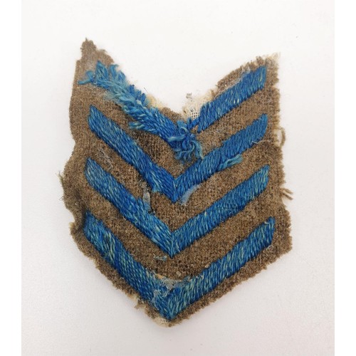 130 - Two WWI Wounded Stripes No.4 with an Overseas Service four chevrons patch. UK shipping £14.