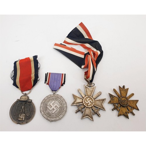 229 - WWII German replica medals: Luftschutz Medal, Two Merit Crosses with Swords and Eastern Front medal.... 