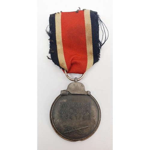 229 - WWII German replica medals: Luftschutz Medal, Two Merit Crosses with Swords and Eastern Front medal.... 