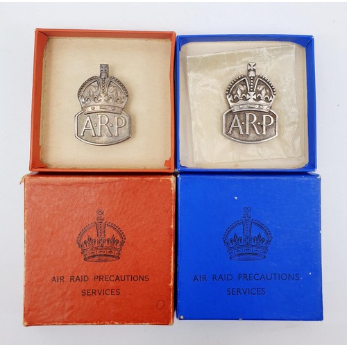 231 - Two WWII hallmarked silver ARP wardens lapel badges in presentation boxes and silver ARP pin badge. ... 