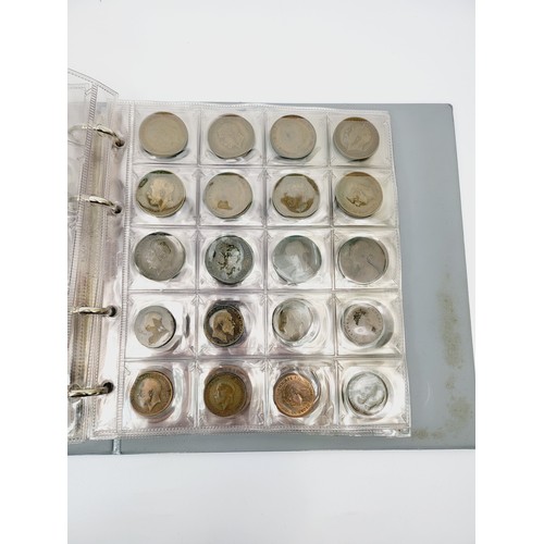 42 - A folder of British coinage including uncirculated. UK shipping £14.