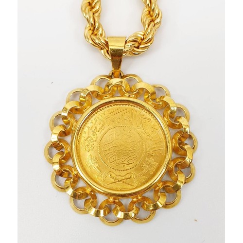 14 - A Saudi Arabian gold Guinea coin in an 18ct gold pendant mount on an 18ct gold chain, chain length 8... 