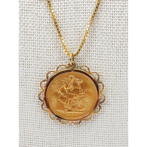 16 - A Queen Elizabeth II sovereign, 1966, in a 9ct gold mount on an 18ct gold chain, chain length 50cm, ... 