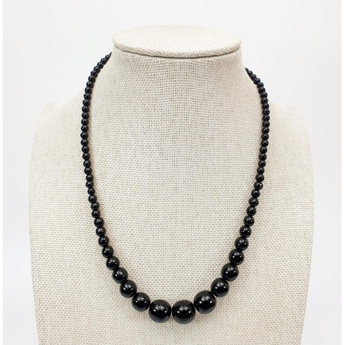 29 - A vintage jet bead necklace, length 40cm together with a jet pendant, length 5cm. UK shipping £14.