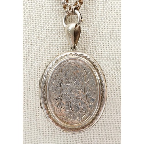 30 - An antique silver plated locket, length 5.5cm on a white metal chain, length 47cm. UK shipping £14.