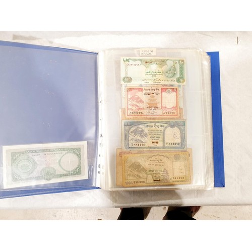 60 - A folder of world bank notes. UK shipping £14.