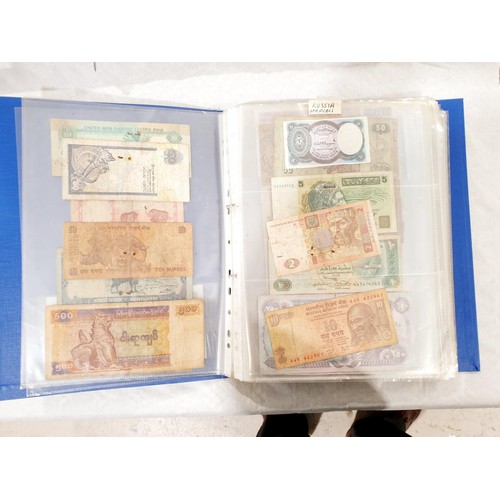 60 - A folder of world bank notes. UK shipping £14.