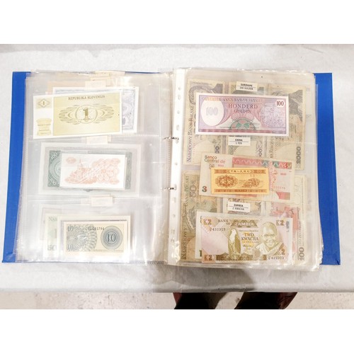 60 - A folder of world bank notes. UK shipping £14.