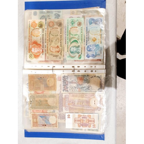 60 - A folder of world bank notes. UK shipping £14.