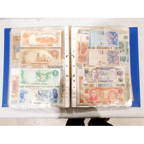 60 - A folder of world bank notes. UK shipping £14.