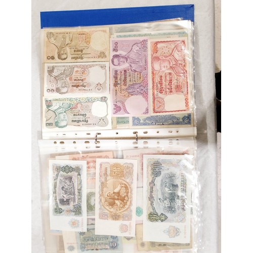 60 - A folder of world bank notes. UK shipping £14.