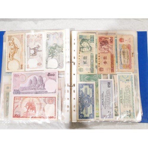 60 - A folder of world bank notes. UK shipping £14.