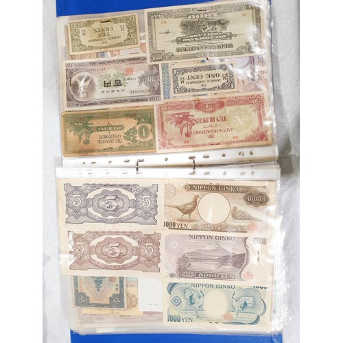 60 - A folder of world bank notes. UK shipping £14.