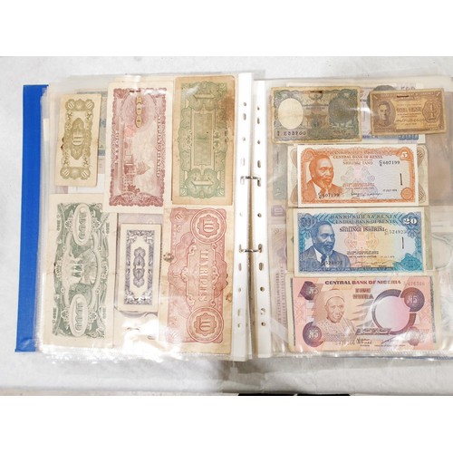 60 - A folder of world bank notes. UK shipping £14.