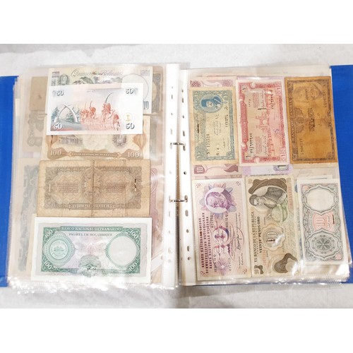 60 - A folder of world bank notes. UK shipping £14.