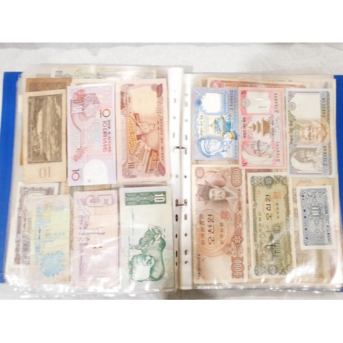 60 - A folder of world bank notes. UK shipping £14.