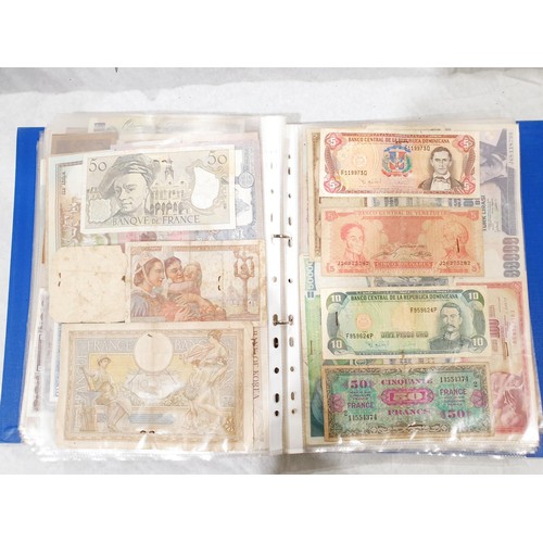 60 - A folder of world bank notes. UK shipping £14.