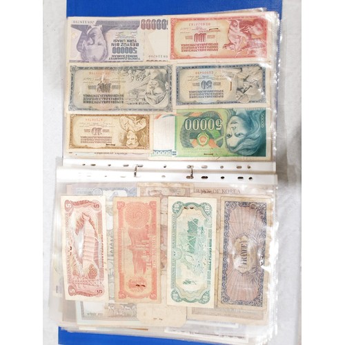 60 - A folder of world bank notes. UK shipping £14.