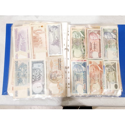 60 - A folder of world bank notes. UK shipping £14.