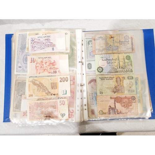 60 - A folder of world bank notes. UK shipping £14.